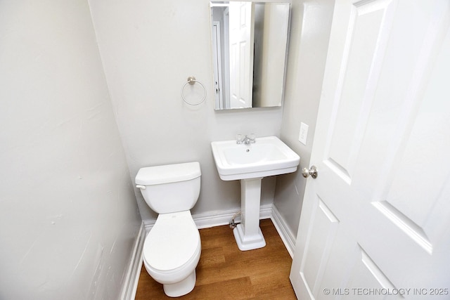 1107 Hillcrest Ave, Tahlequah, OK 74464 - half bathroom with baseboards and wood finished floors