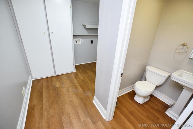 1107 Hillcrest Ave, Tahlequah, OK 74464 - bathroom with wood finished floors and toilet