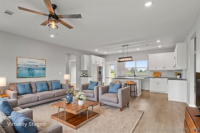 59 Michael, Durant, OK 74730 - living area with recessed lighting, light wood-type flooring, and a ceiling fan