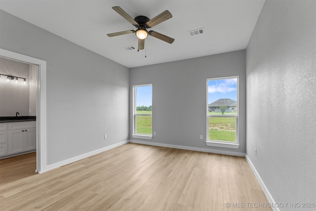 59 Michael, Durant, OK 74730 - unfurnished room with light wood-style flooring, healthy amount of natural light, and a ceiling fan
