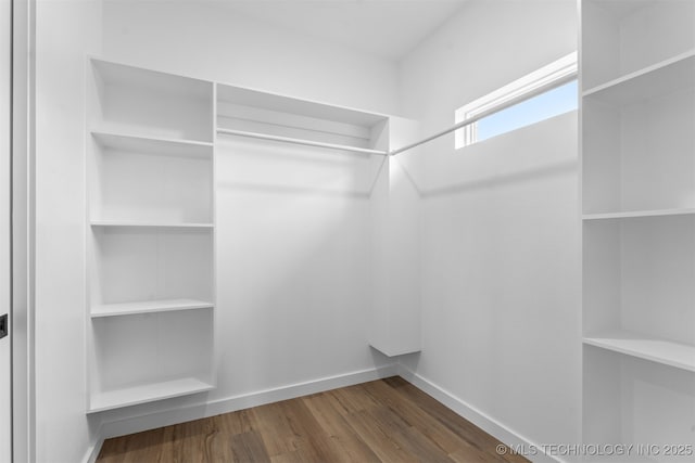 59 Michael, Durant, OK 74730 - walk in closet featuring wood finished floors