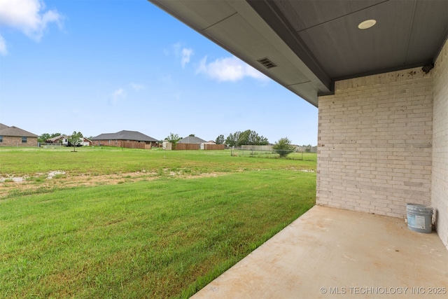 59 Michael, Durant, OK 74730 - view of green lawn with a patio area