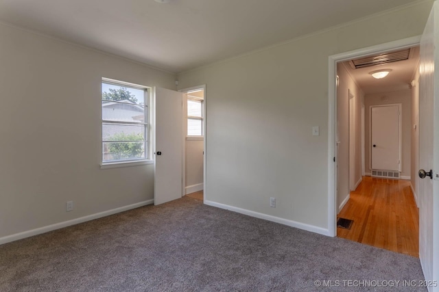 1632 E 55th Pl, Tulsa, OK 74105 - carpeted empty room featuring attic access and ornamental molding