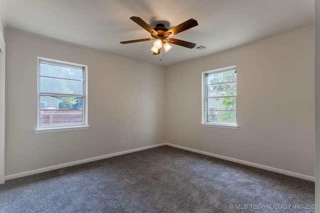 1632 E 55th Pl, Tulsa, OK 74105 - unfurnished room featuring dark carpet, ceiling fan, and crown molding