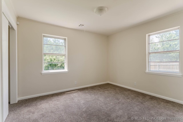 1632 E 55th Pl, Tulsa, OK 74105 - unfurnished bedroom featuring carpet floors and ornamental molding
