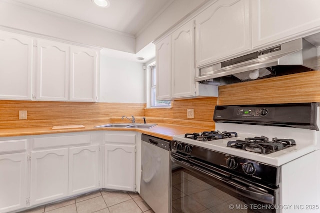1632 E 55th Pl, Tulsa, OK 74105 - kitchen with gas stove, dishwasher, under cabinet range hood, light tile patterned floors, and white cabinetry