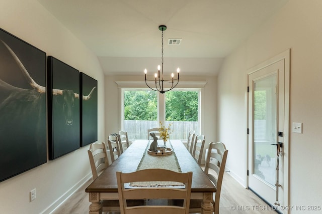 12926 S 20th Pl E, Jenks, OK 74037 - dining room featuring a chandelier, light wood-style floors, and vaulted ceiling