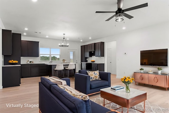 108 Michael, Calera, OK 74730 - living room with light wood-style flooring, recessed lighting, a chandelier, and ceiling fan