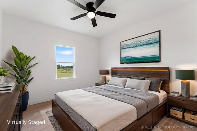 108 Michael, Calera, OK 74730 - bedroom featuring light wood-style floors and a ceiling fan