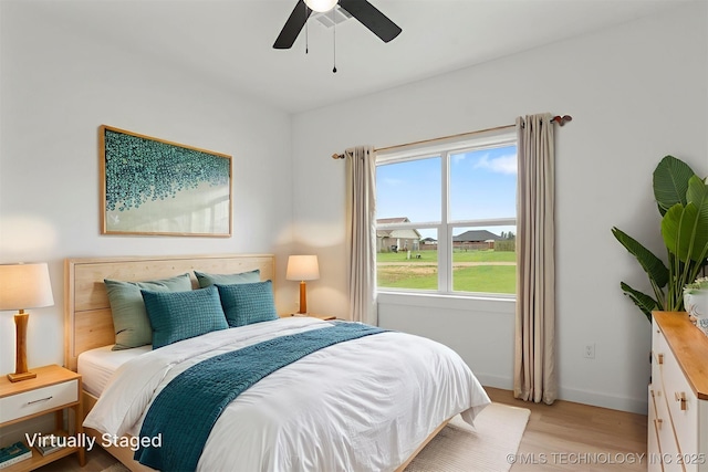 108 Michael, Calera, OK 74730 - bedroom featuring light wood-type flooring and ceiling fan