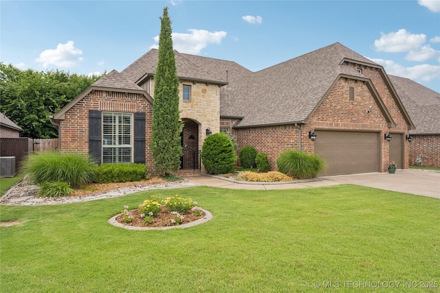 7722 N 142nd Ave E, Owasso, OK 74055 - view of front of house with a shingled roof, brick siding, a garage, and concrete driveway