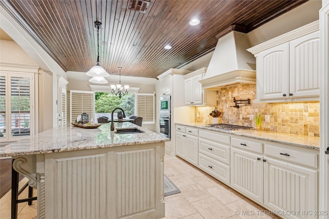 7722 N 142nd Ave E, Owasso, OK 74055 - kitchen featuring custom range hood, healthy amount of natural light, decorative backsplash, stainless steel gas cooktop, and wood ceiling