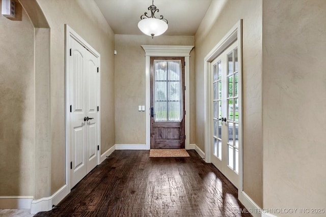 9312 N 93rd Ave E, Owasso, OK 74055 - doorway with dark wood-style floors, french doors, and arched walkways
