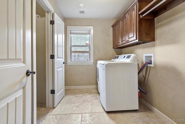 9312 N 93rd Ave E, Owasso, OK 74055 - laundry area with washer and clothes dryer and cabinet space