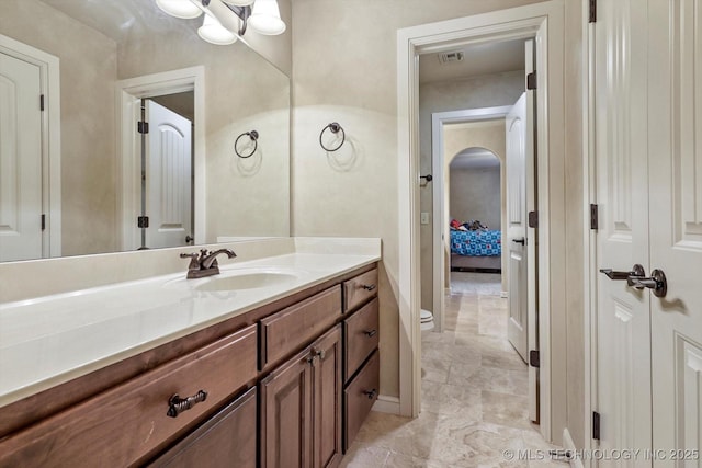 9312 N 93rd Ave E, Owasso, OK 74055 - bathroom featuring vanity, marble finish floors, and a chandelier