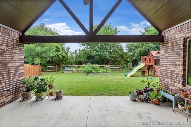 9312 N 93rd Ave E, Owasso, OK 74055 - fenced backyard featuring a playground, a patio, and view of wooded area