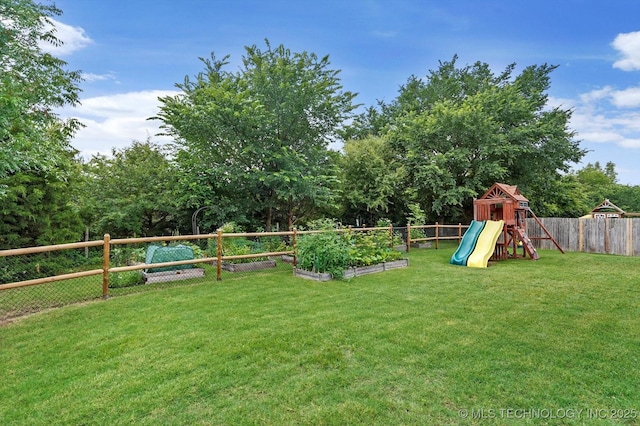 9312 N 93rd Ave E, Owasso, OK 74055 - fenced backyard featuring a garden and a playground