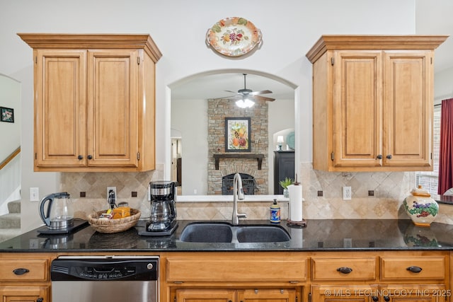 5029 S 168th E Ave, Tulsa, OK 74134 - kitchen with dishwasher, dark stone countertops, a ceiling fan, and backsplash