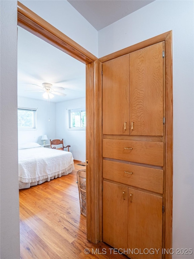 1508 E Seminole Ave, Mcalester, OK 74501 - bedroom with light wood finished floors and multiple windows