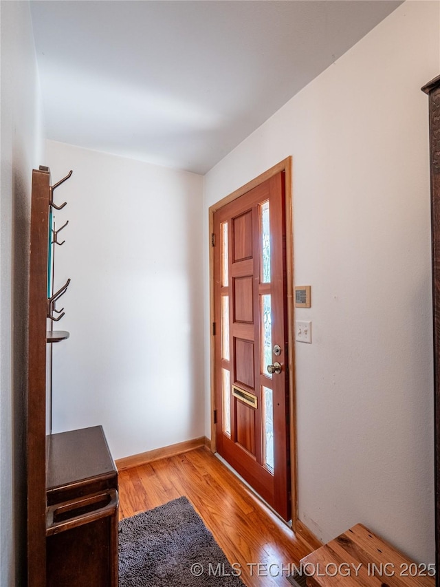 1508 E Seminole Ave, Mcalester, OK 74501 - entrance foyer featuring light wood finished floors and baseboards