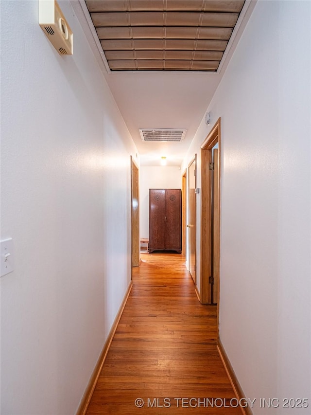 1508 E Seminole Ave, Mcalester, OK 74501 - hallway featuring light wood-style floors and baseboards