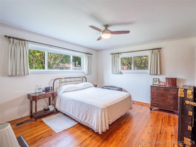 1508 E Seminole Ave, Mcalester, OK 74501 - bedroom with light wood finished floors and a ceiling fan