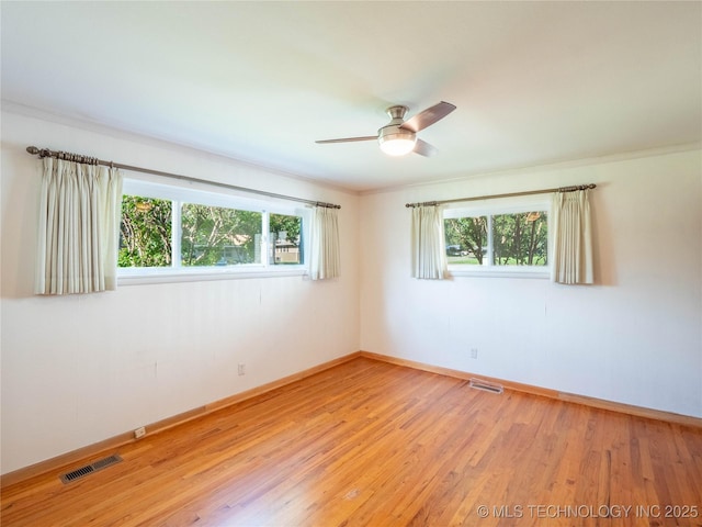 1508 E Seminole Ave, Mcalester, OK 74501 - unfurnished room featuring light wood-style floors, ceiling fan, and crown molding