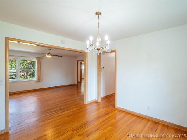 1508 E Seminole Ave, Mcalester, OK 74501 - unfurnished room with a chandelier, light wood-style flooring, and ceiling fan