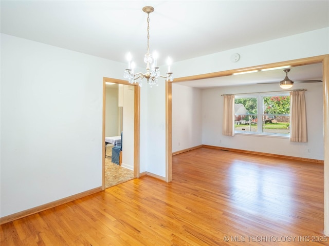 1508 E Seminole Ave, Mcalester, OK 74501 - empty room featuring a chandelier and light wood-type flooring