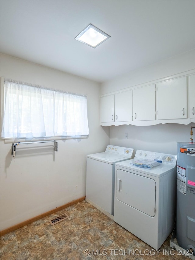 1508 E Seminole Ave, Mcalester, OK 74501 - laundry room with water heater, cabinet space, separate washer and dryer, and stone finish flooring