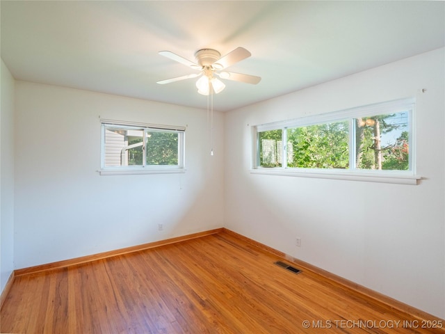1508 E Seminole Ave, Mcalester, OK 74501 - spare room featuring healthy amount of natural light, light wood finished floors, and ceiling fan