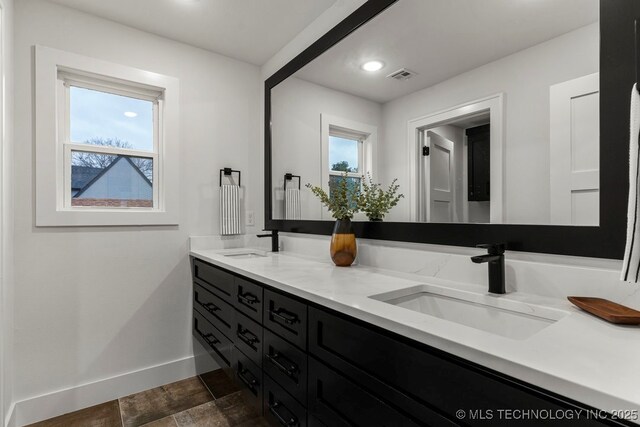 1035 E 36th Pl, Tulsa, OK 74105 - full bath featuring double vanity, healthy amount of natural light, and recessed lighting
