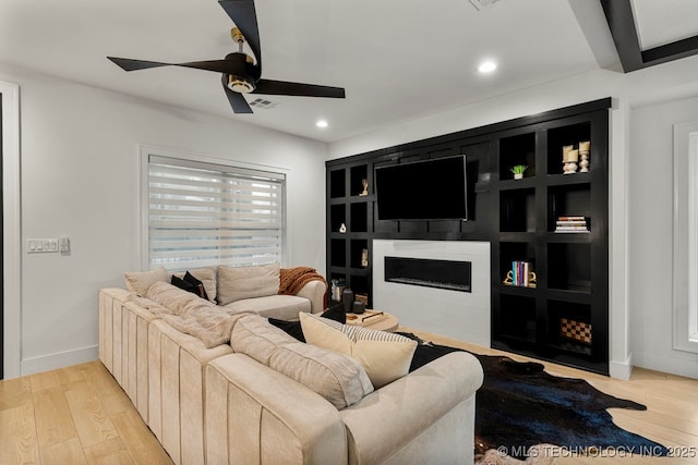 1035 E 36th Pl, Tulsa, OK 74105 - living area featuring a fireplace, light wood finished floors, a ceiling fan, and recessed lighting