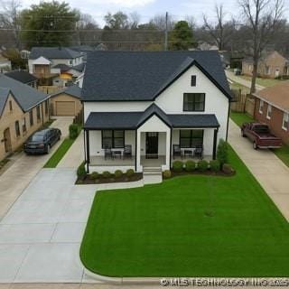 1035 E 36th Pl, Tulsa, OK 74105 - view of front facade featuring concrete driveway, a porch, and a front lawn