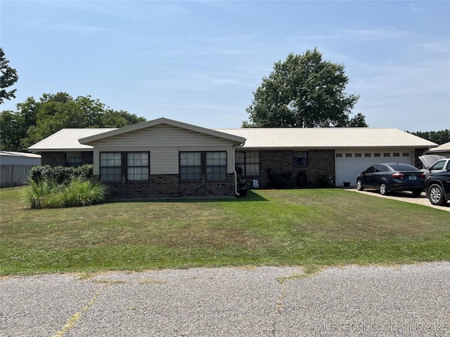 1203 NW 5th St, Stigler, OK 74462 - ranch-style home featuring a garage, a front yard, brick siding, and a metal roof