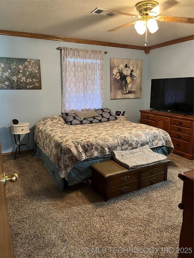 1203 NW 5th St, Stigler, OK 74462 - bedroom with crown molding, carpet, a textured ceiling, and a ceiling fan