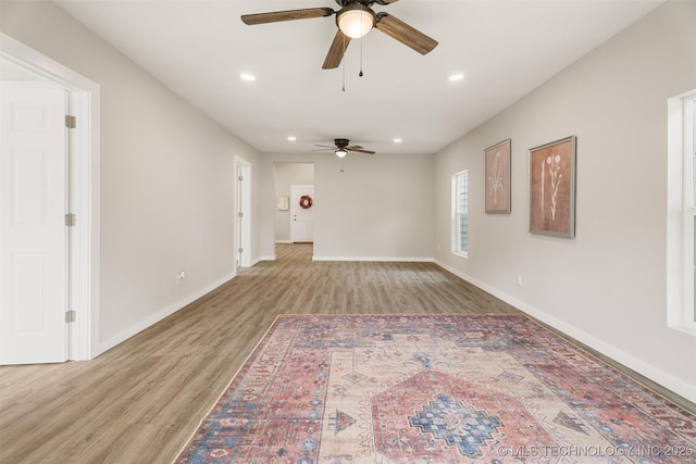 107 S Wyandotte Ave, Dewey, OK 74029 - unfurnished living room featuring ceiling fan, light wood-style floors, and recessed lighting