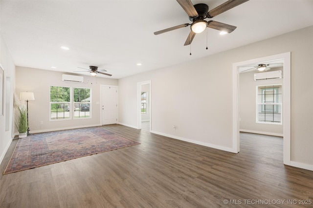 107 S Wyandotte Ave, Dewey, OK 74029 - empty room featuring a wall mounted air conditioner, ceiling fan, wood finished floors, and recessed lighting