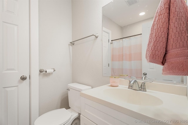 107 S Wyandotte Ave, Dewey, OK 74029 - bathroom with vanity and a textured wall