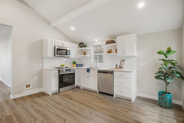 107 S Wyandotte Ave, Dewey, OK 74029 - kitchen with stainless steel appliances, open shelves, light wood-style floors, white cabinetry, and recessed lighting