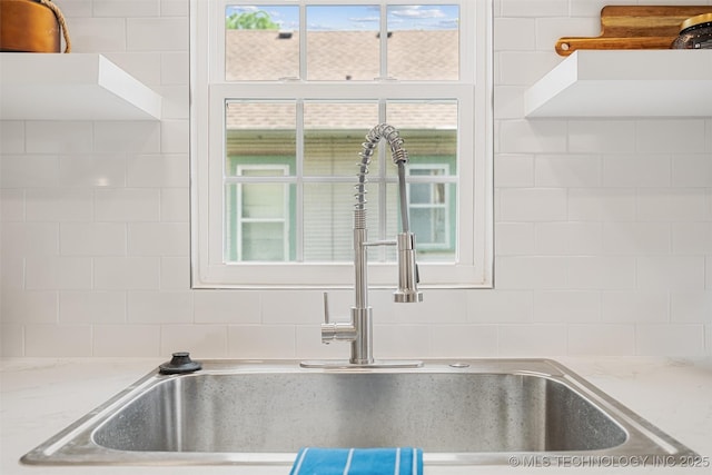 107 S Wyandotte Ave, Dewey, OK 74029 - kitchen view of backsplash and light stone countertops