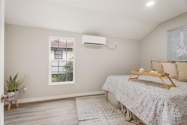 107 S Wyandotte Ave, Dewey, OK 74029 - bedroom featuring an AC wall unit, light wood-style floors, vaulted ceiling, and recessed lighting