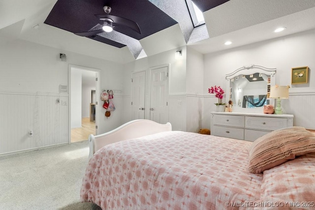 9703 S 100th E Ave, Tulsa, OK 74133 - bedroom with wainscoting, carpet flooring, recessed lighting, and a skylight