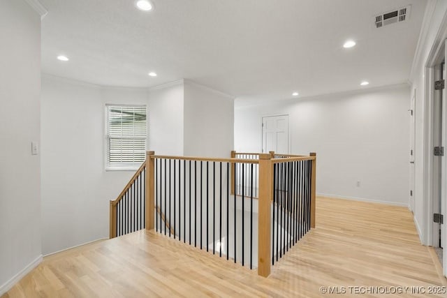 9703 S 100th E Ave, Tulsa, OK 74133 - hallway featuring wood finished floors, an upstairs landing, recessed lighting, and ornamental molding