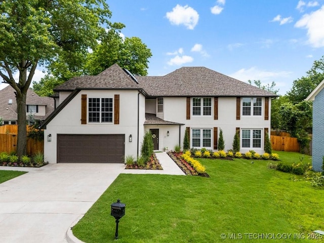 9703 S 100th E Ave, Tulsa, OK 74133 - view of front facade with stucco siding, concrete driveway, a garage, and a shingled roof