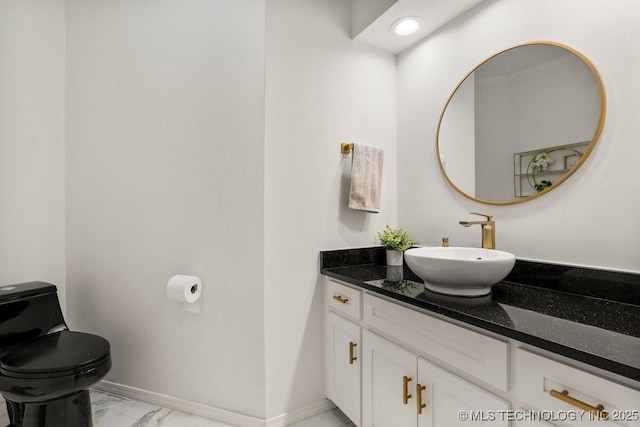 9703 S 100th E Ave, Tulsa, OK 74133 - bathroom featuring vanity and marble finish flooring