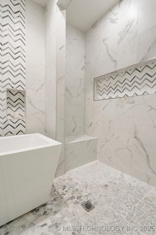 9703 S 100th E Ave, Tulsa, OK 74133 - bathroom featuring a freestanding tub and tile walls