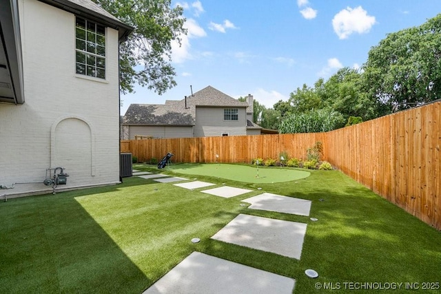 9703 S 100th E Ave, Tulsa, OK 74133 - fenced backyard with a putting green