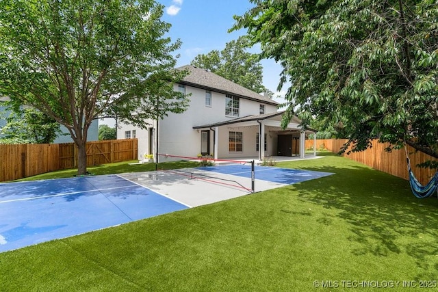 9703 S 100th E Ave, Tulsa, OK 74133 - rear view of house with a fenced backyard, stucco siding, and a patio area