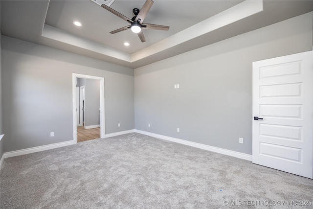 250 Maple Leaf Dr, Durant, OK 74701 - empty room with ceiling fan, a tray ceiling, carpet, and recessed lighting